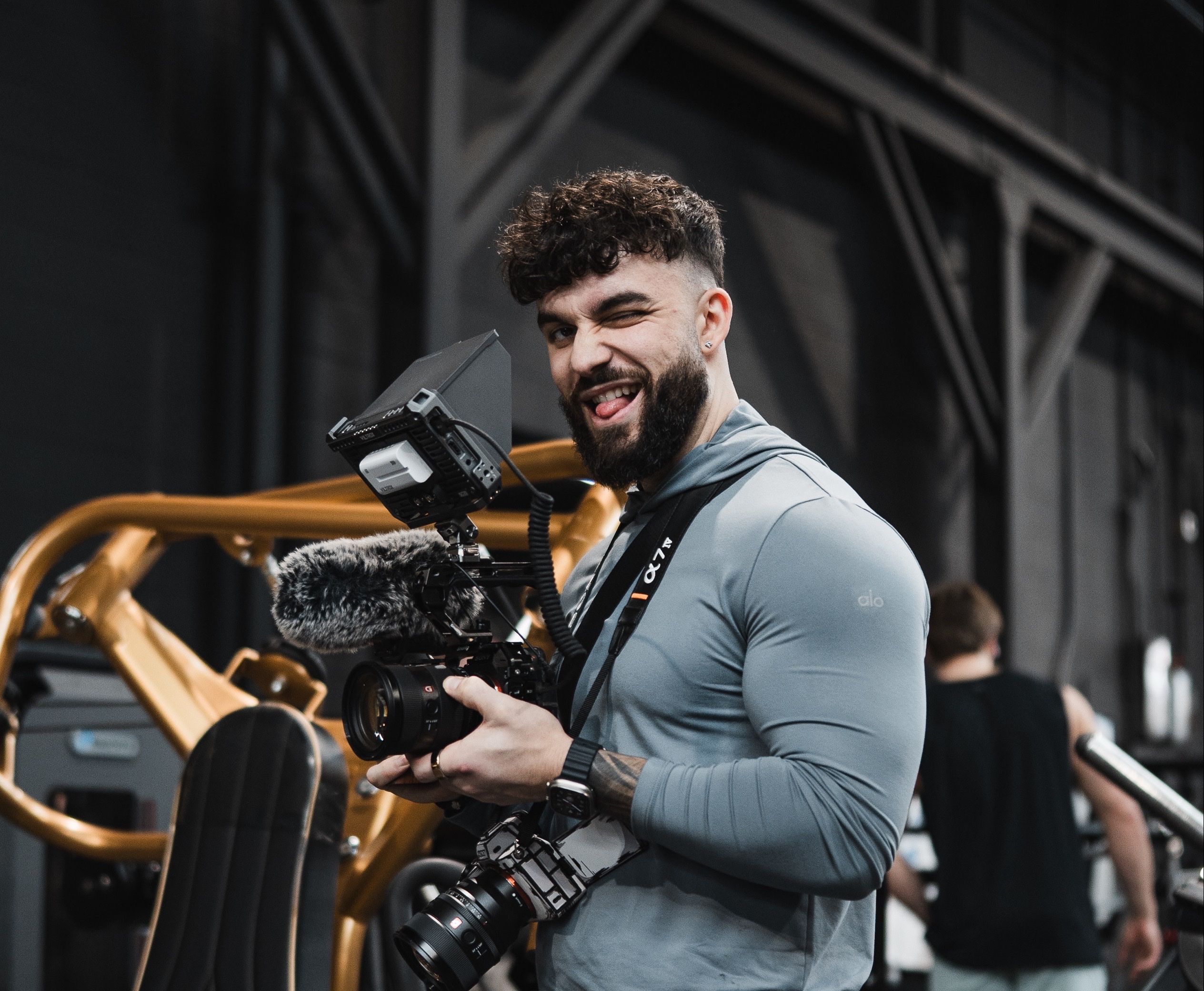 Aleks Bujak on set, holding his camera