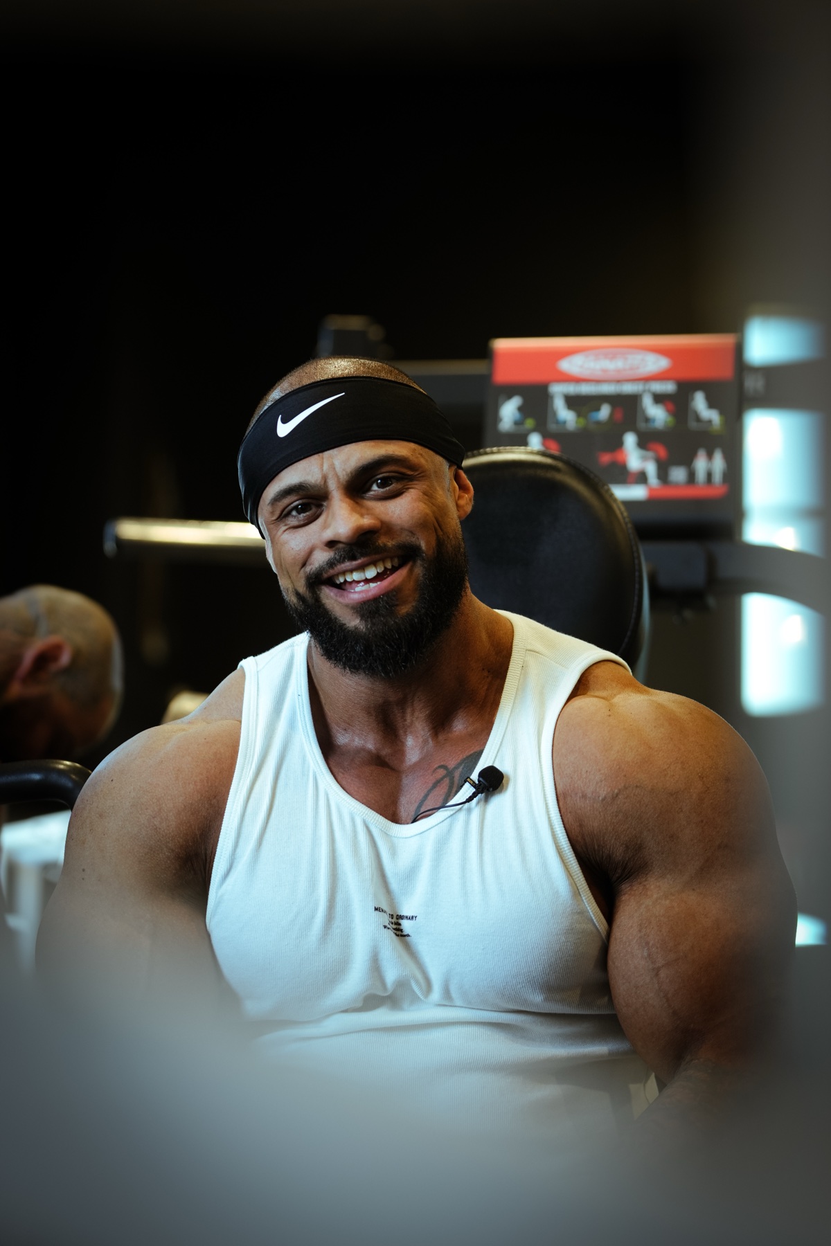 Kellen Wilson laughing between sets, headband and mic on