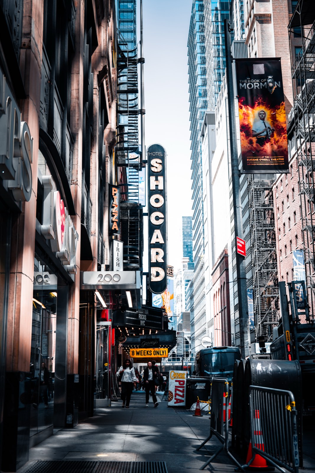A theatre-district block in New York, late afternoon