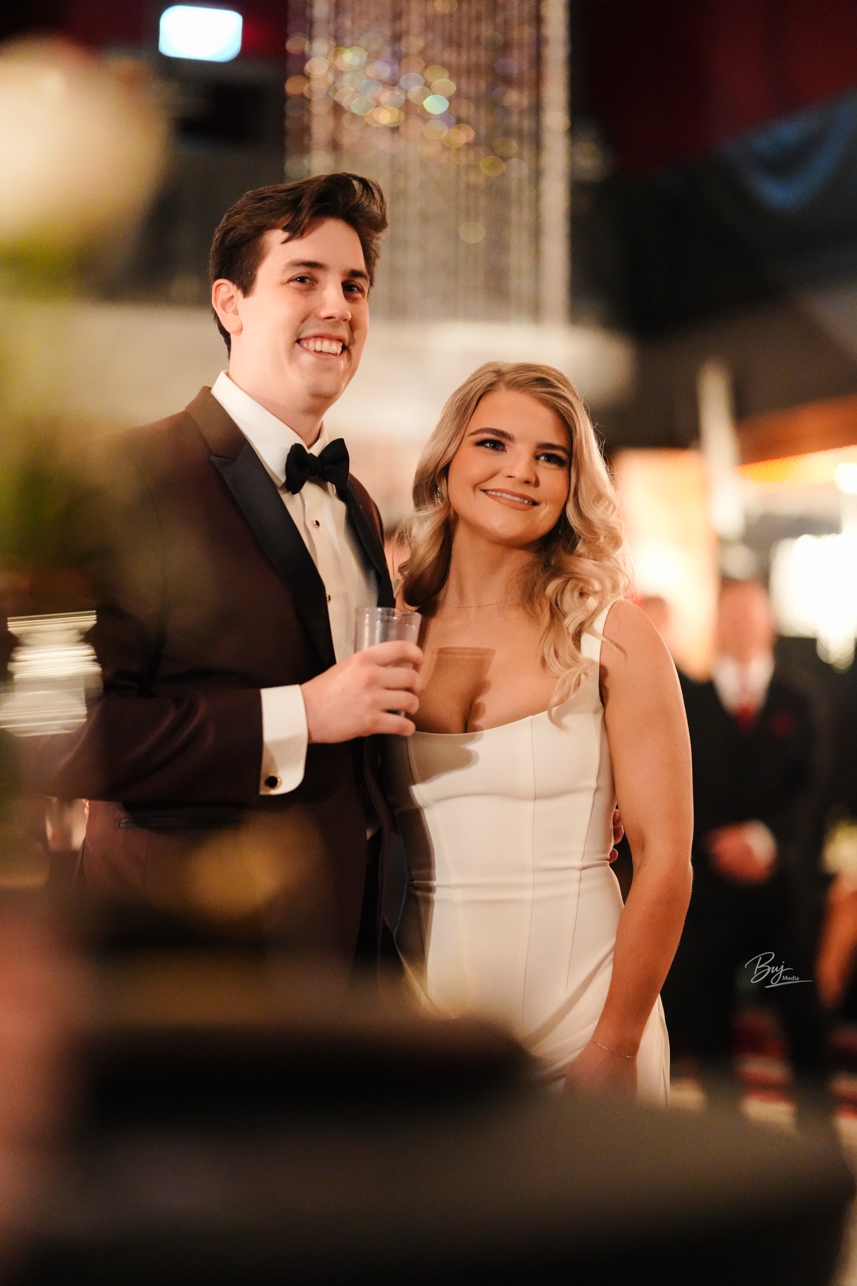 A couple smiling together at their wedding reception