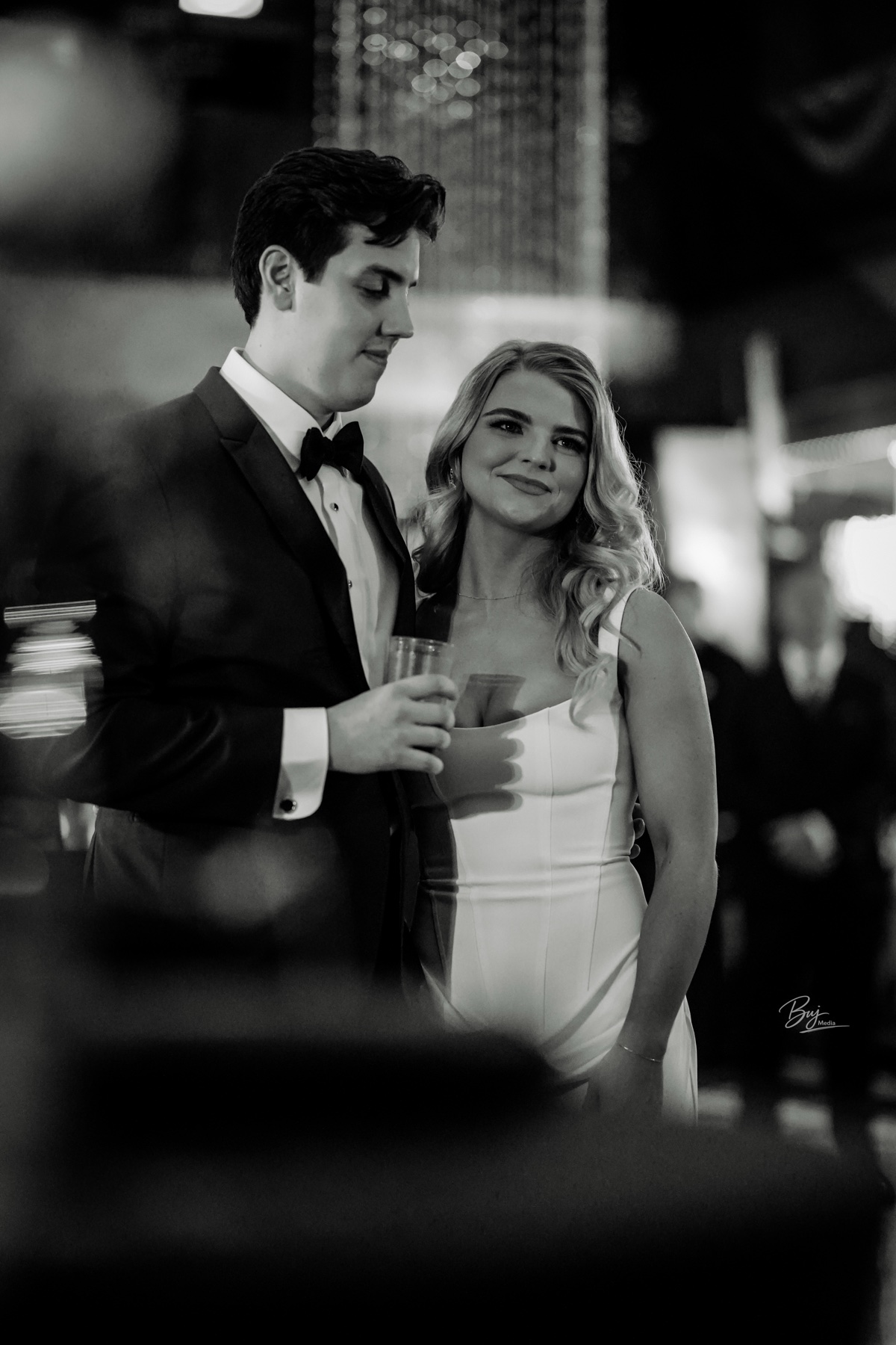A couple sharing a toast at their wedding reception